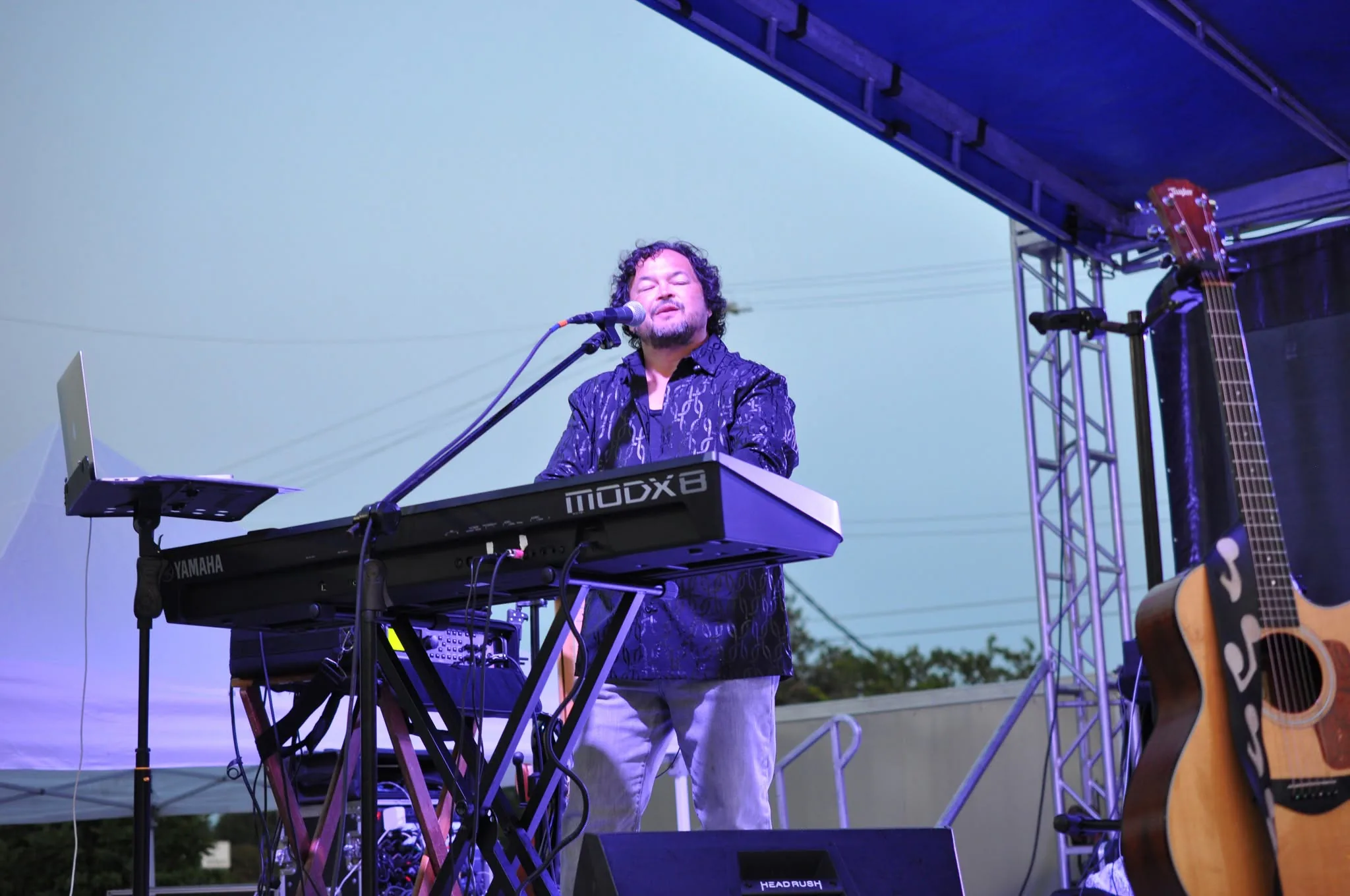 Keyboard player performing on the main stage
